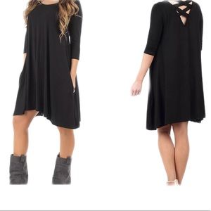 Women's Black dress with Cross back pocket Size: M
